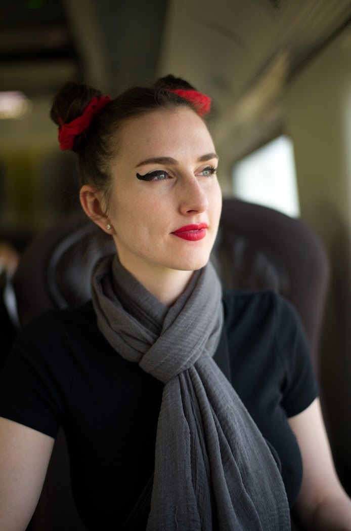 Marian DeLaCroix on train - Journey and transformation theme