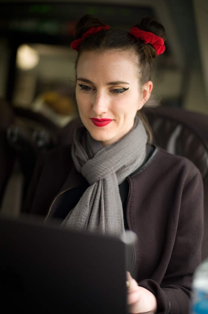 Marian DeLaCroix writing at computer - Author at work